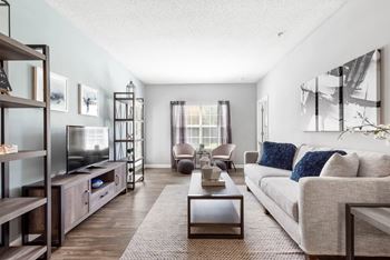 a living room with a couch and a tv